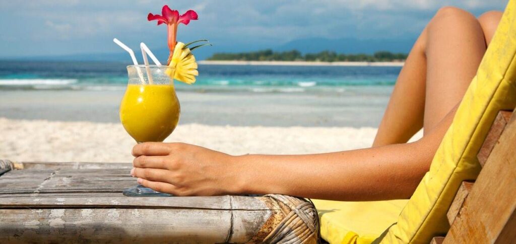 holding-a-cocktail-on-a-tropical-beach